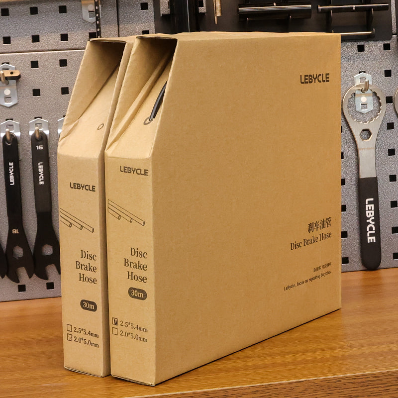 LEBYCLE bicycle disc brake hose coil next to its 30m boxed packaging