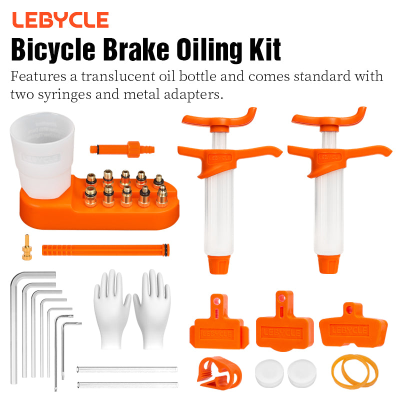 LeBycle brake bleed kit syringes in use bleeding a bicycle hydraulic disc brake at both the lever and caliper
