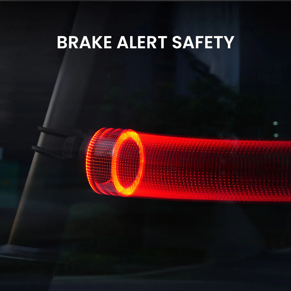 Vivi 50 light showing a bright brake alert flare on a bike at night