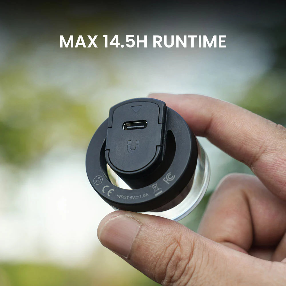 Hand holding the Vivi 50's QuickSwap power module showing the USB-C charging port and input rating