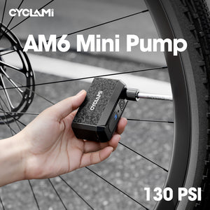 CYCLAMI AM6 Mini inflating a bicycle tire on the roadside