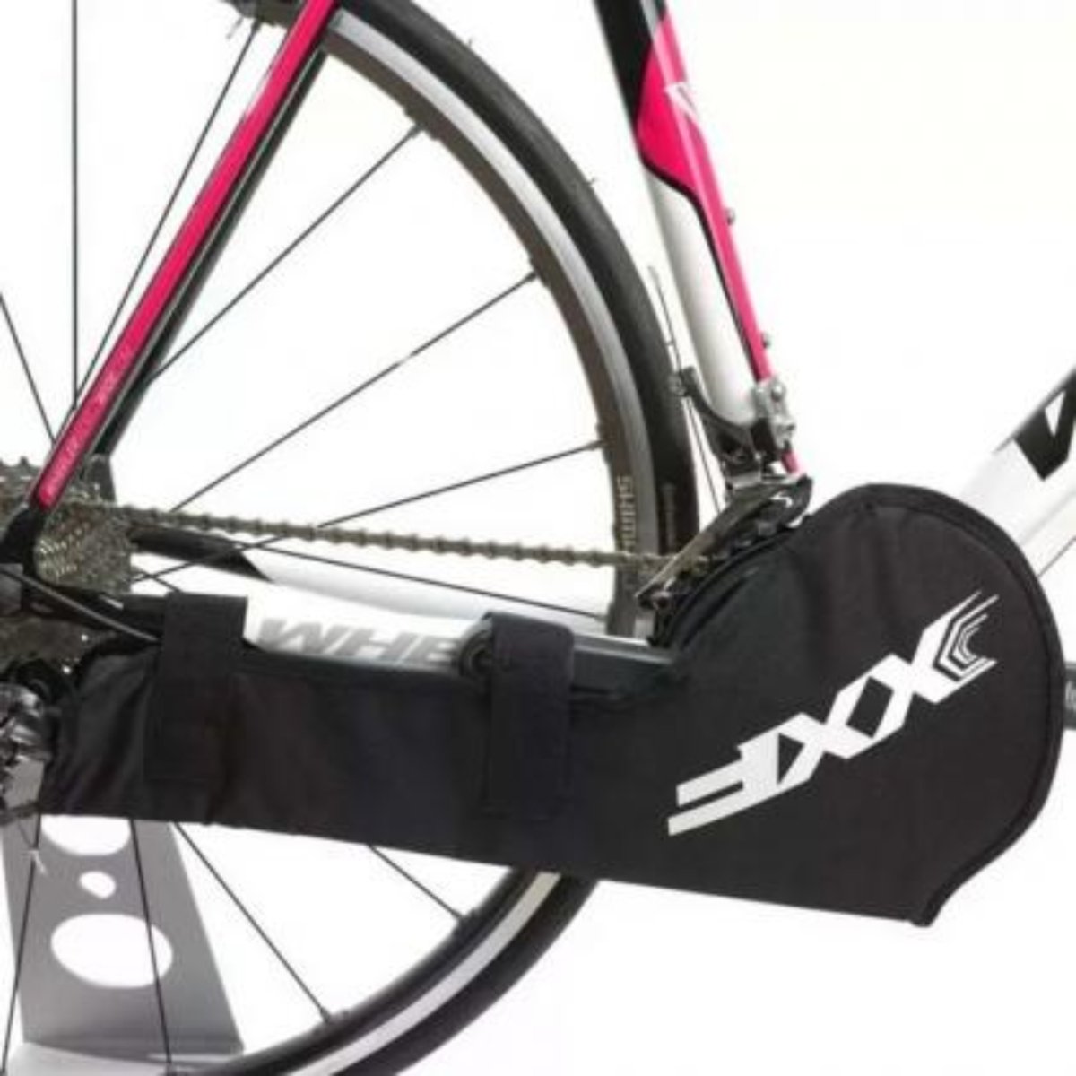 XXF NC08 bike chain cover fitted over chainset, black with XXF logo